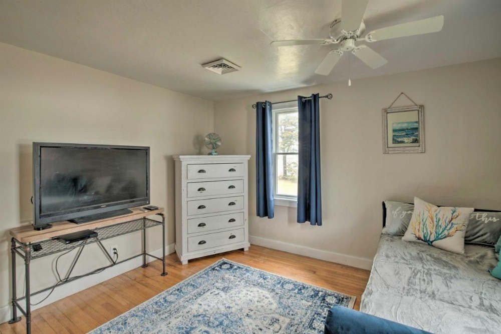 Waterfront Cape Cod Home with Sunroom and Fire Pit Image 16